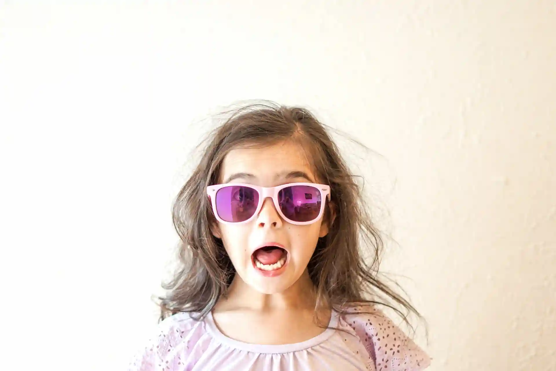 Excited girl with purple glasses